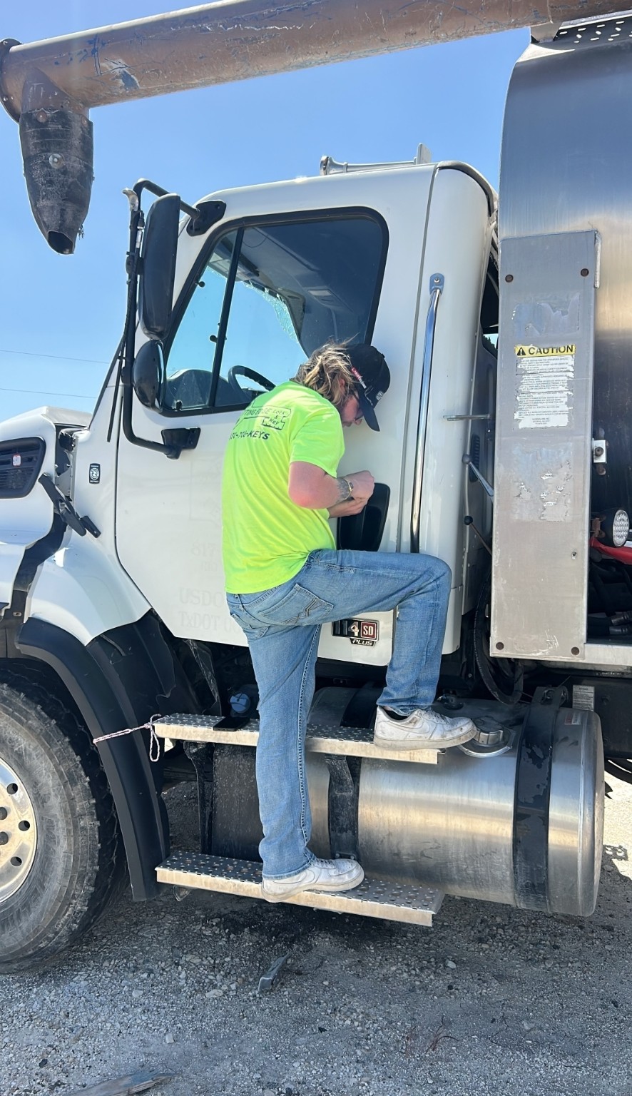 Cutting Edge technician working on a commercial truck door lock